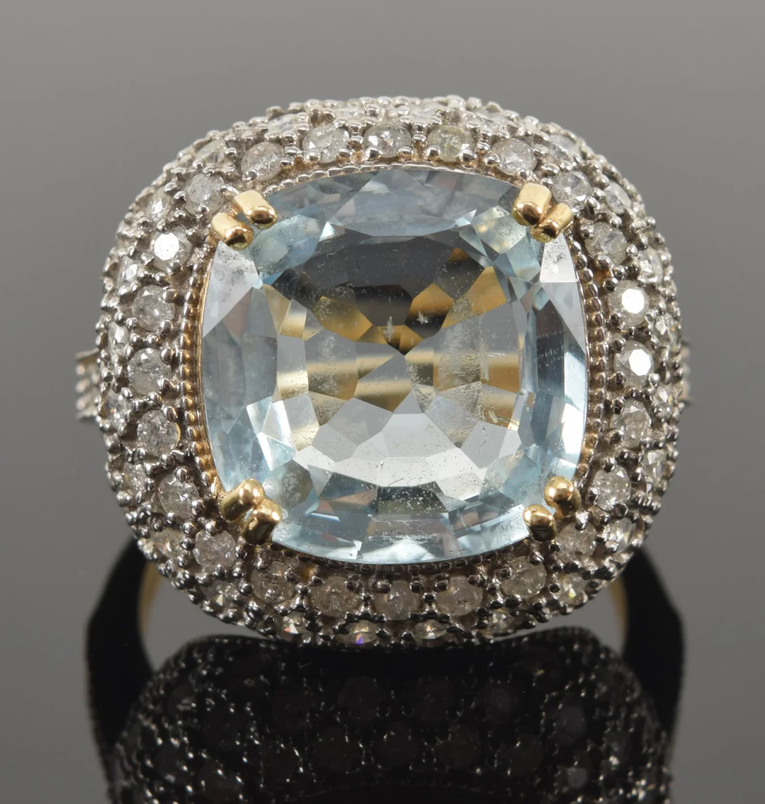 14K gold 8.5ct aquamarine and diamond ring. Cushion cut aquamarine