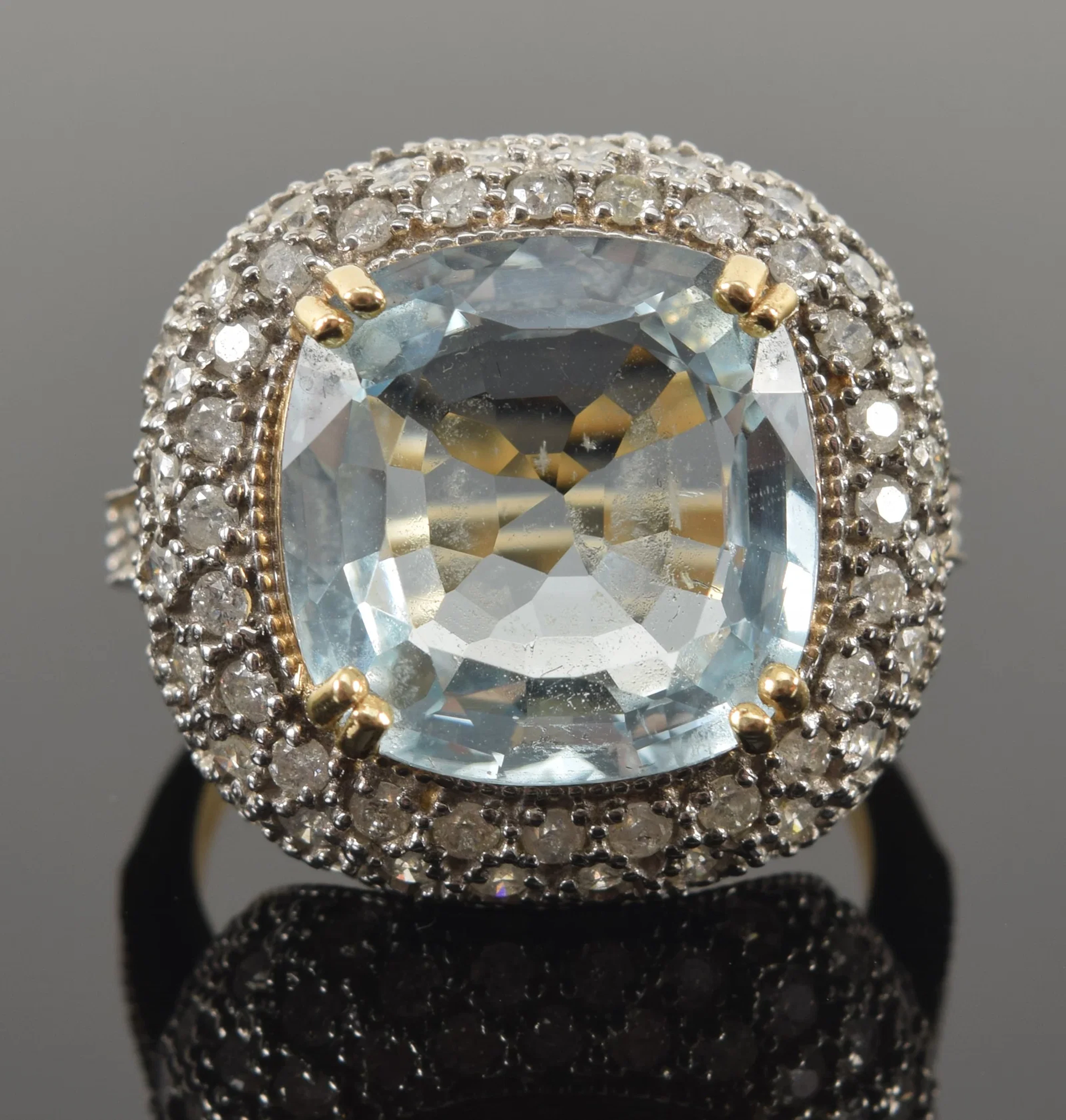 14K gold 8.5ct aquamarine and diamond ring. Cushion cut aquamarine