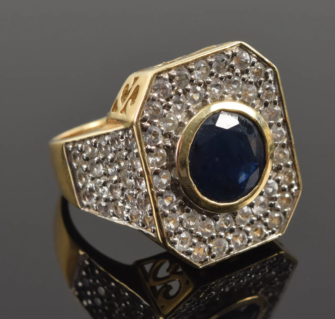 14K gold sapphire and diamond pave ring. Large round cut sapphire