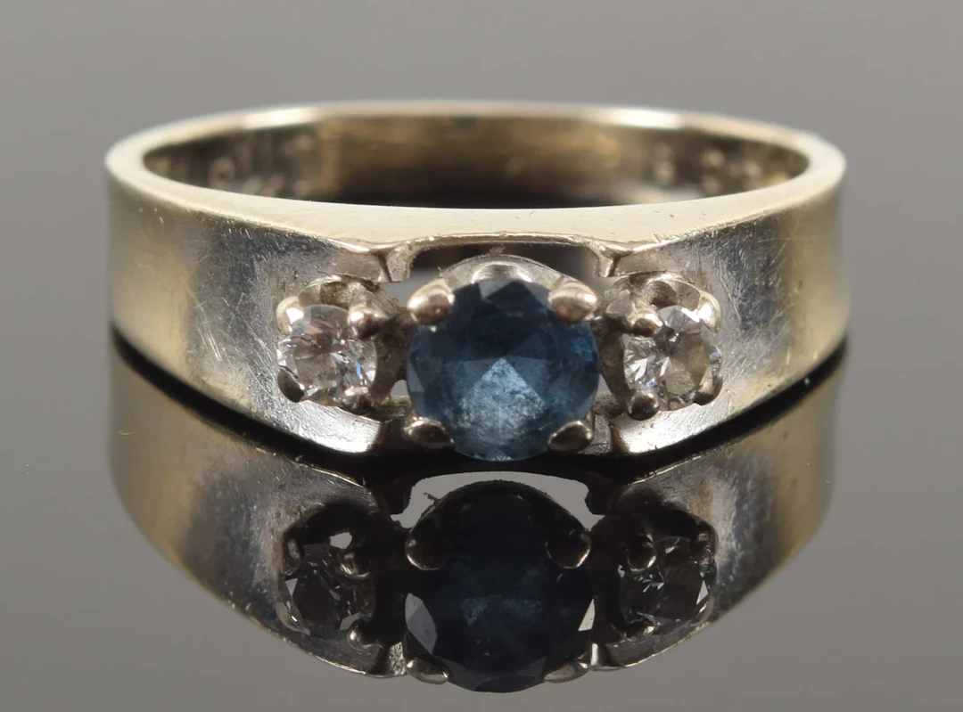 Vintage 14K gold sapphire and diamond ring. Round cut sapphire measures