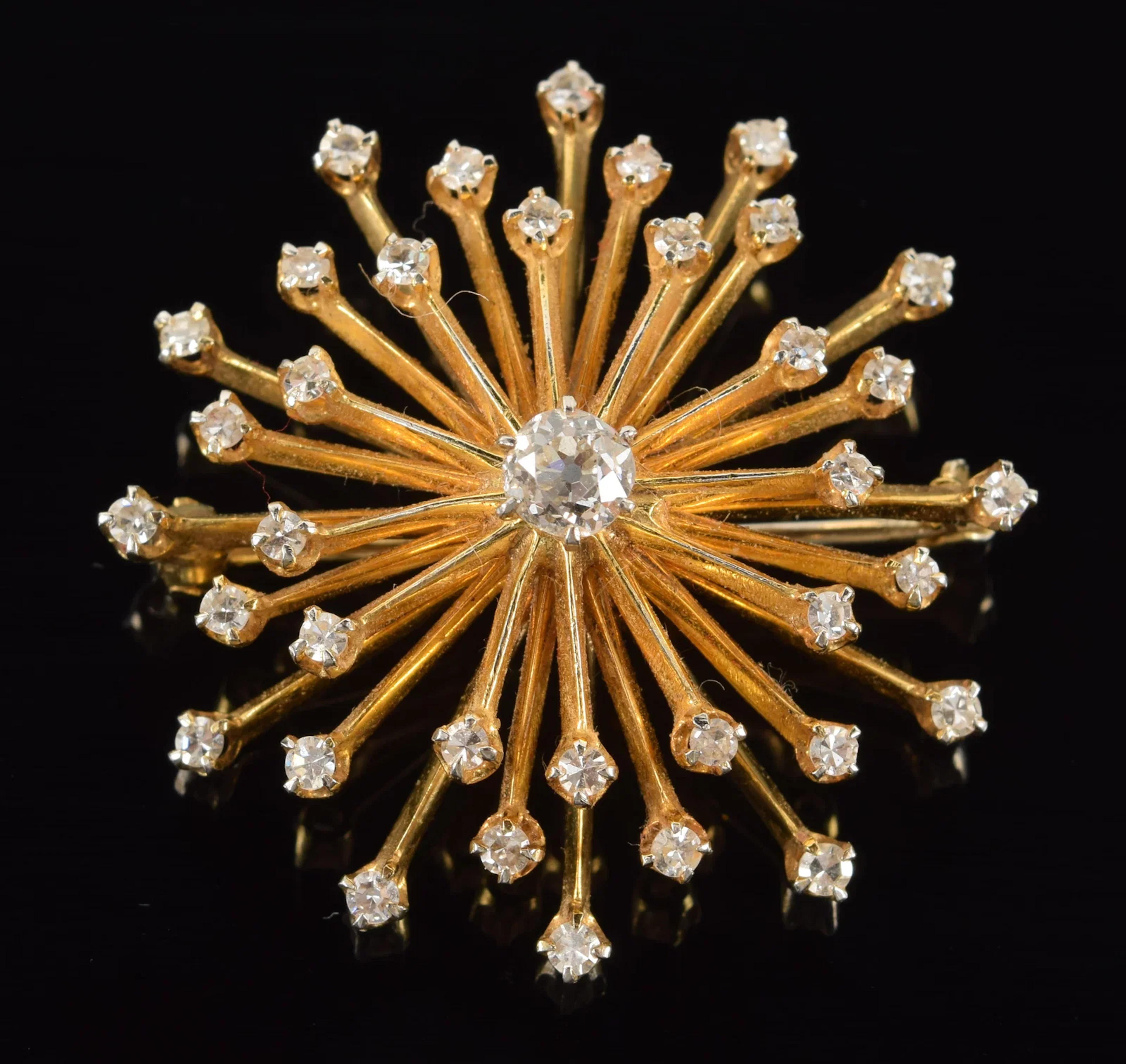 14K gold diamond starburst pin. Central round cut diamond approx.