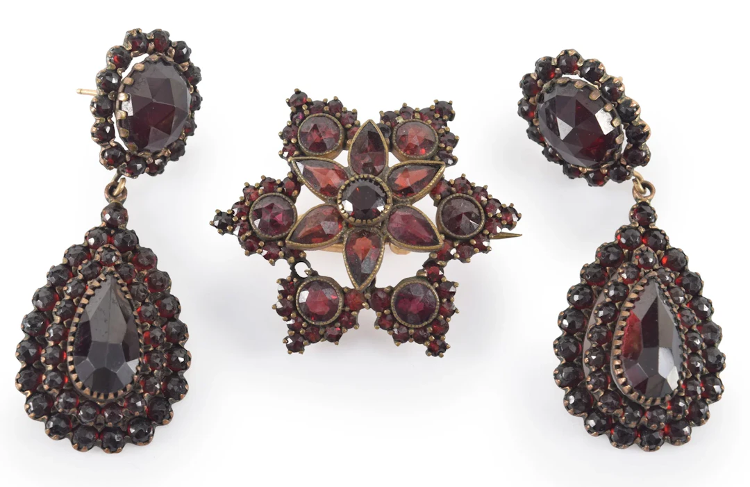 Antique garnet jewelry pieces. Pair of drop earrings and a star form