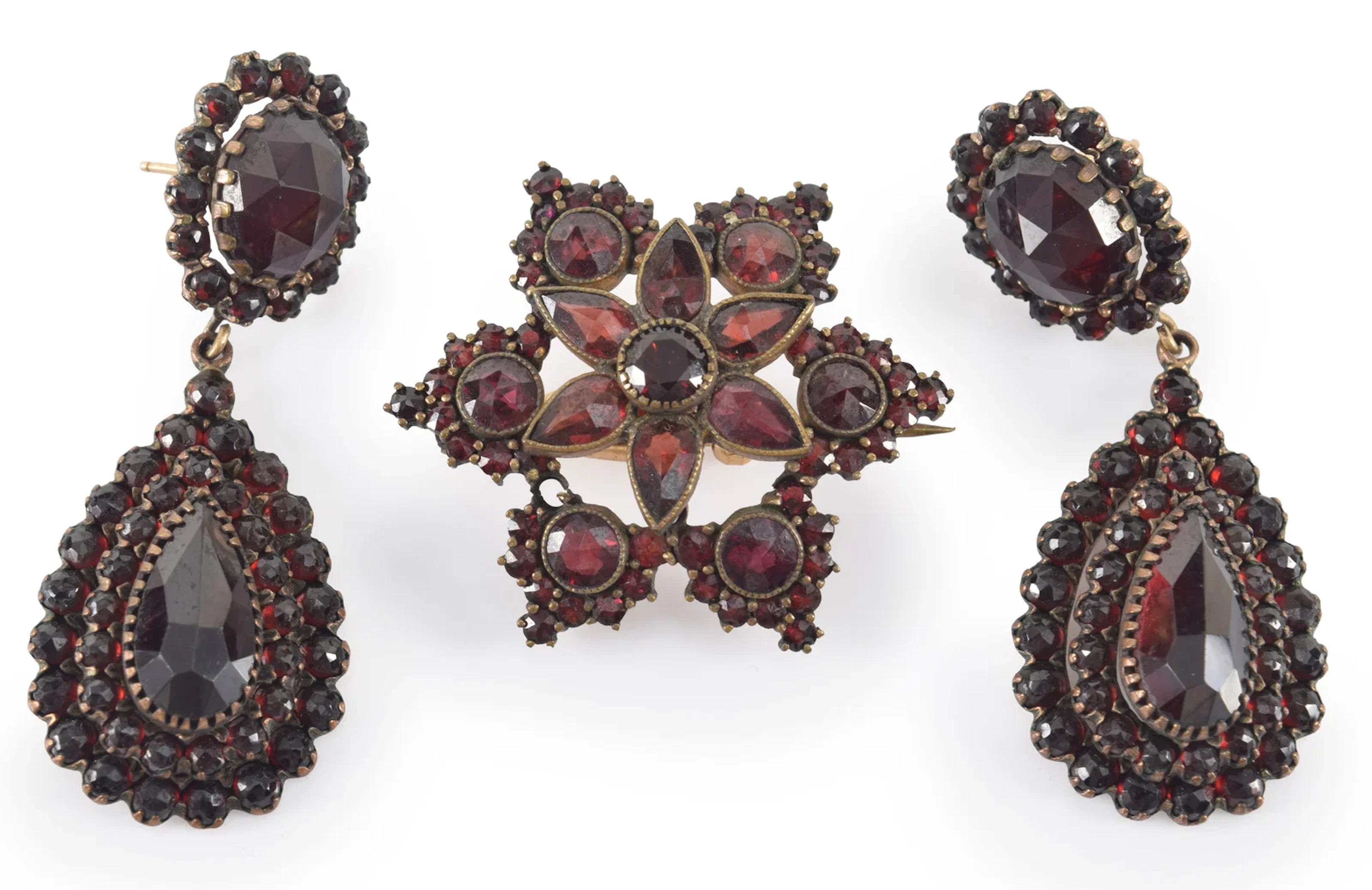 Antique garnet jewelry pieces. Pair of drop earrings and a star form