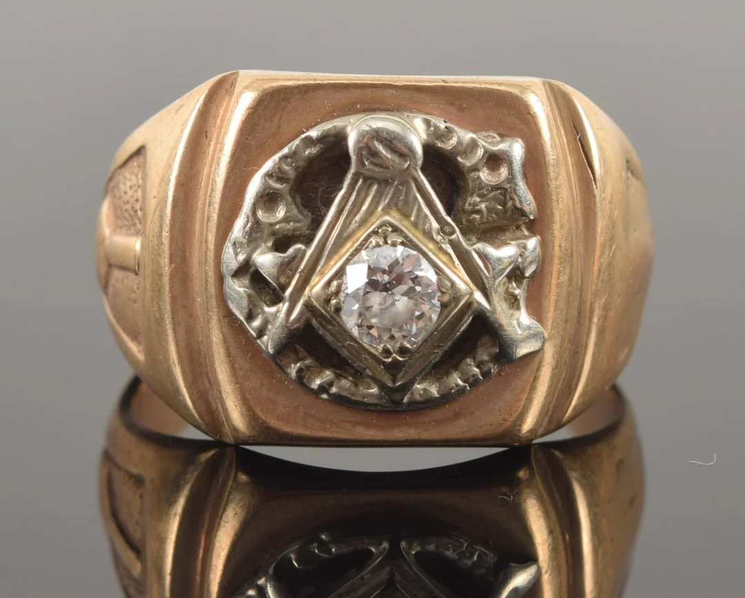 Heavy 10K gold Masonic diamond ring. Round cut diamond measuring approx.