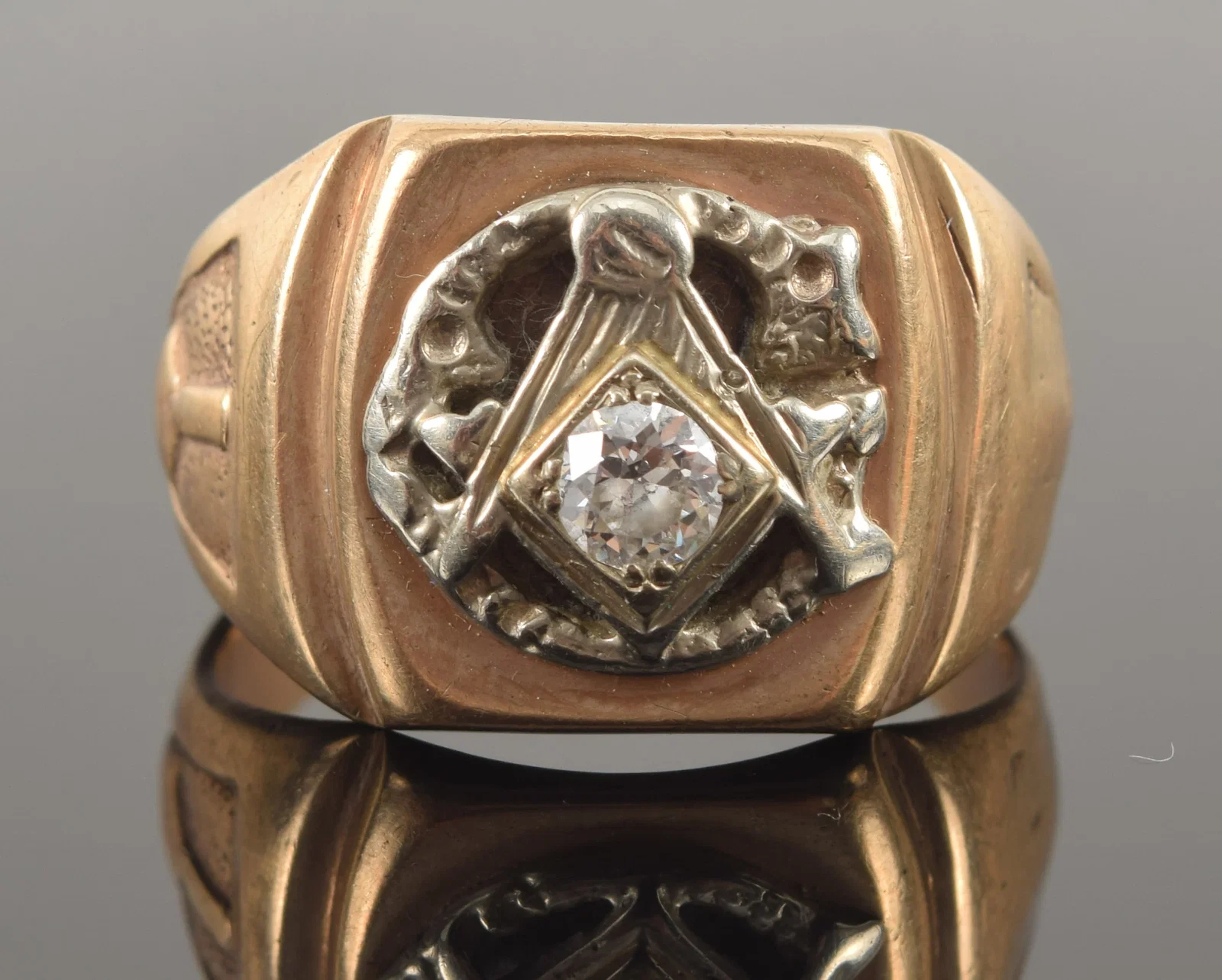 Heavy 10K gold Masonic diamond ring. Round cut diamond measuring approx.