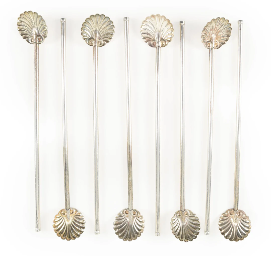 8 Sterling silver shell form sipper stirrers. Length 7.75 in. 2.57 ozt.