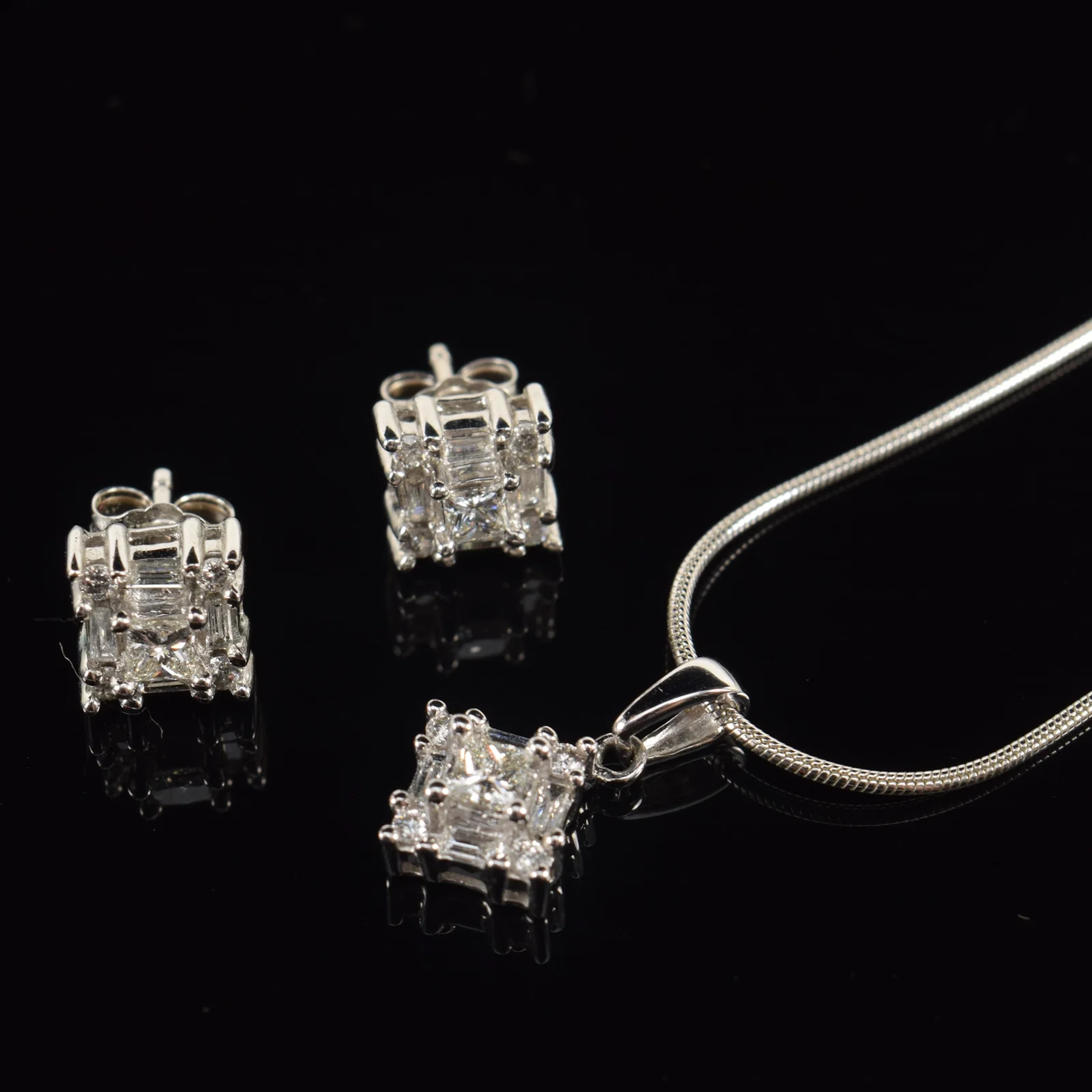 14K white gold diamond earring and pendant necklace set. Square form