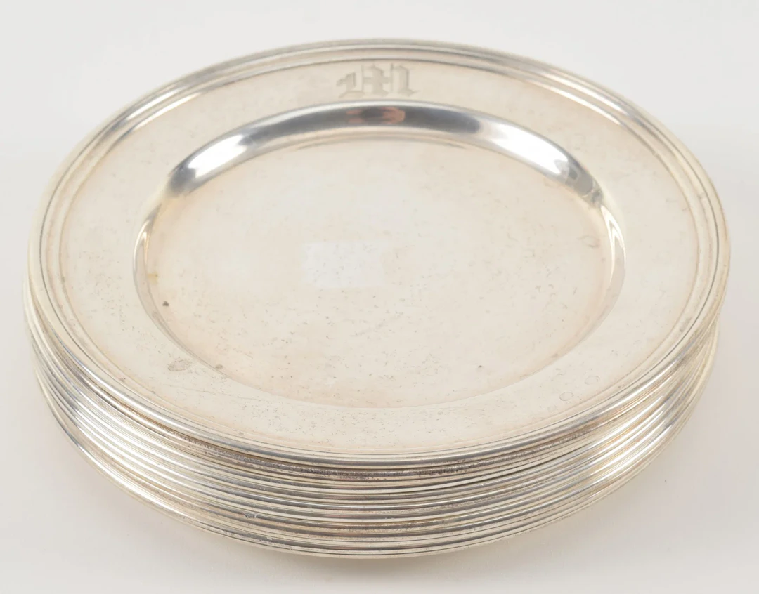 12 International Sterling silver bread plates. Engraved M. Diameter