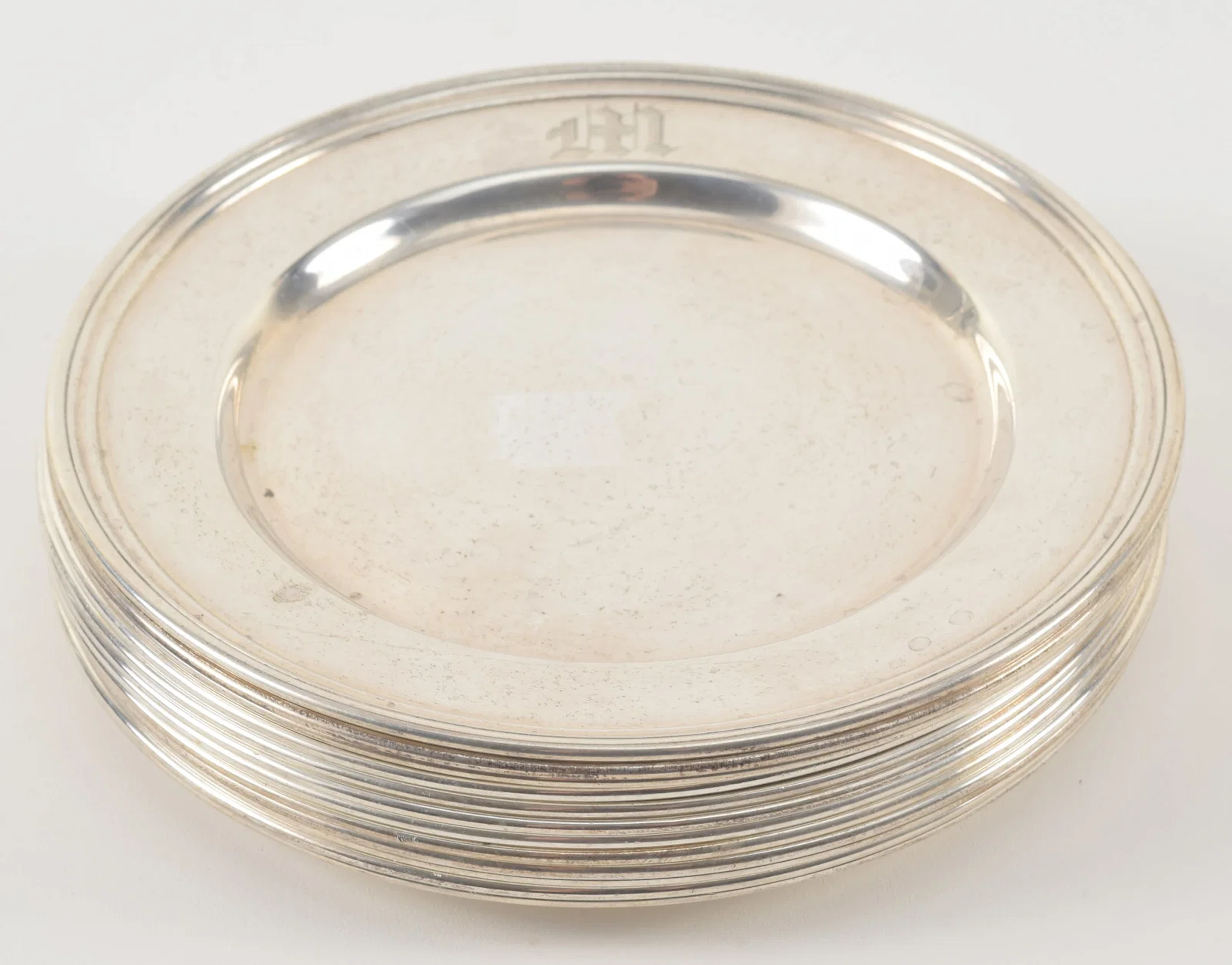 12 International Sterling silver bread plates. Engraved M. Diameter