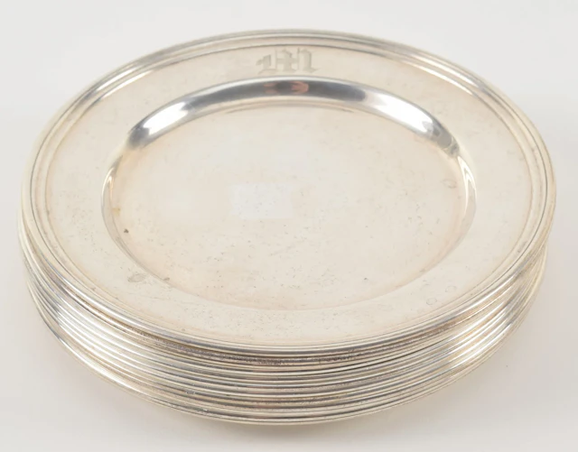 12 International Sterling silver bread plates. Engraved M. Diameter