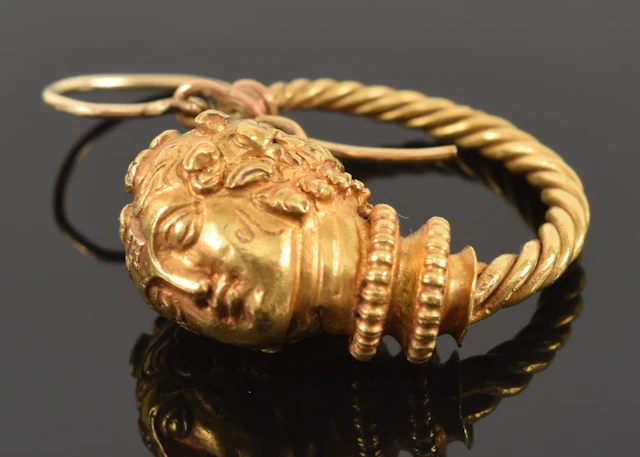 Antique gold Etruscan Revival style single earring. Braided hoop with