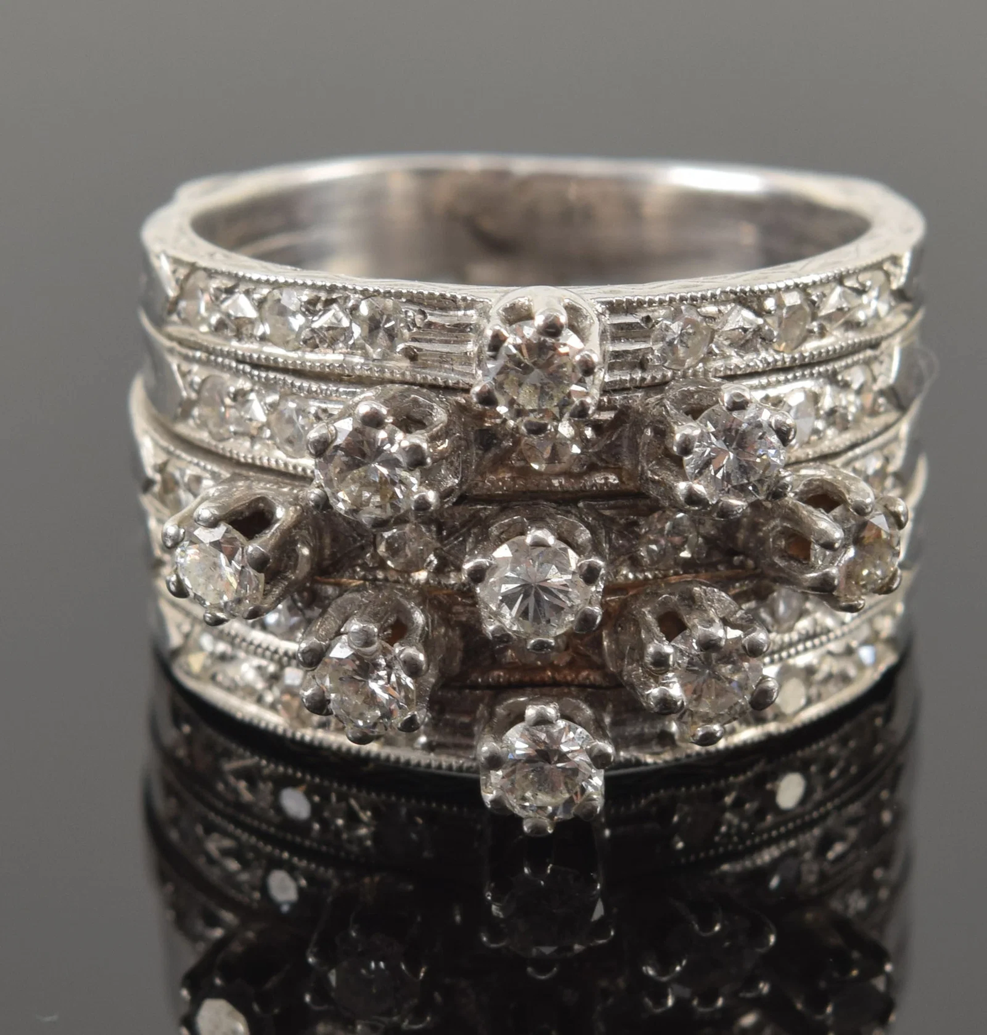 14K white gold multiband diamond ring. 9 round cut prong set diamonds