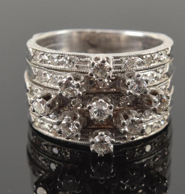 14K white gold multiband diamond ring. 9 round cut prong set diamonds