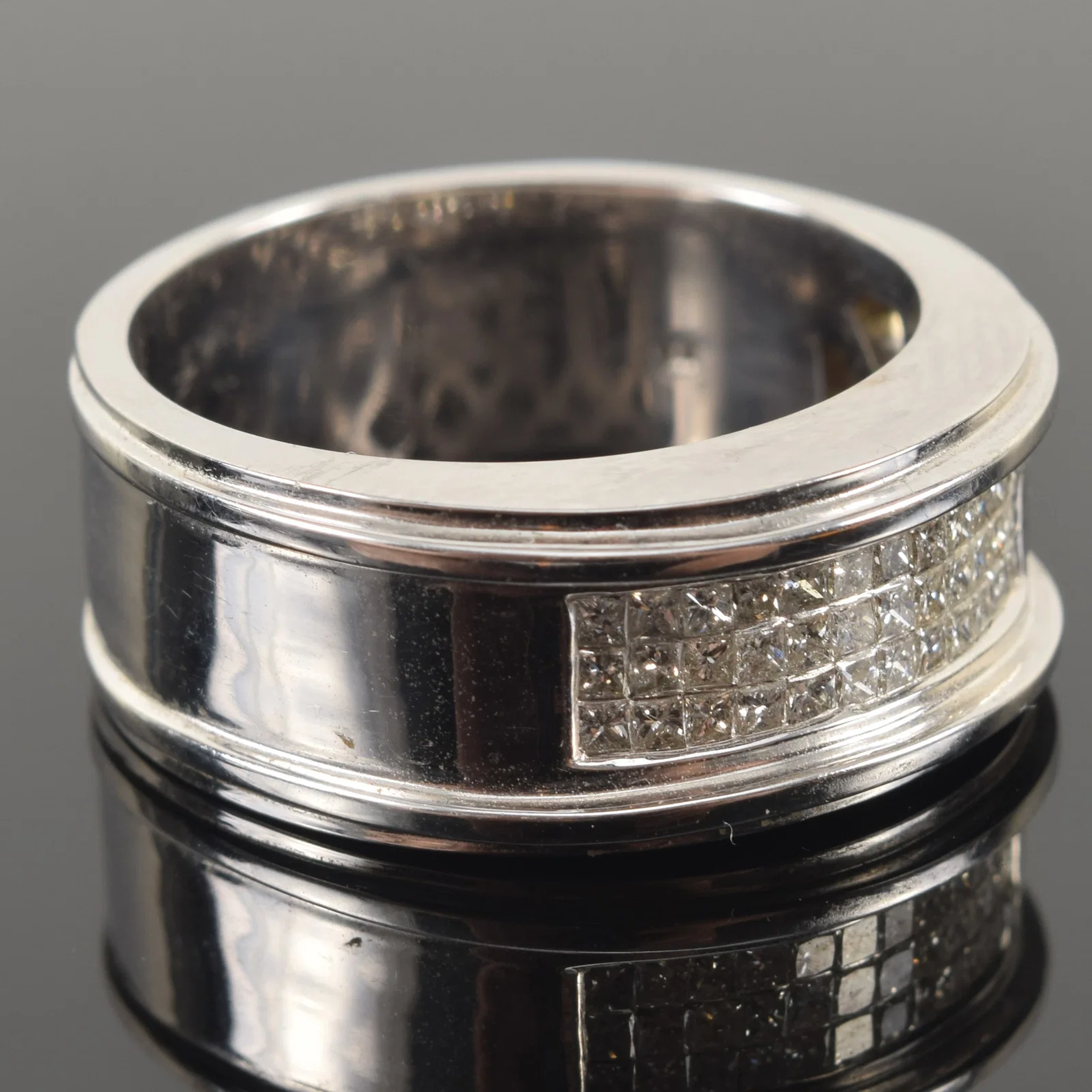14K white gold men's diamond pave ring. Raised shoulders flanking