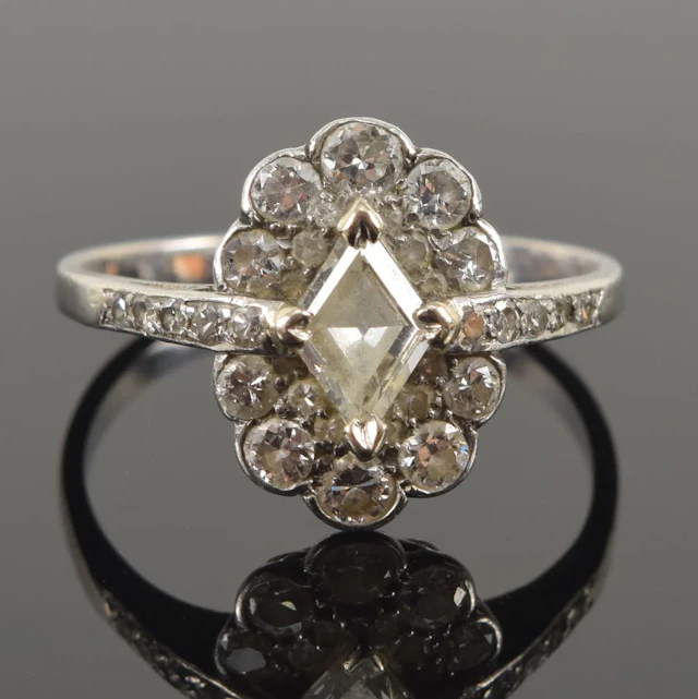 Vintage 18K gold diamond halo ring. Rhomboid shaped center diamond