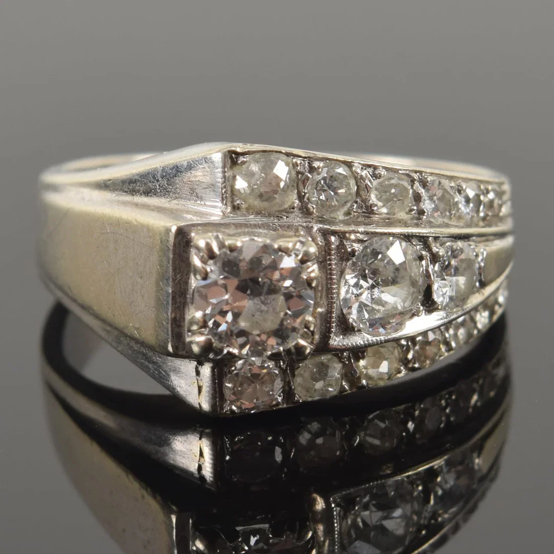 Retro 14K white gold diamond ring. 17 graduated round cut diamonds