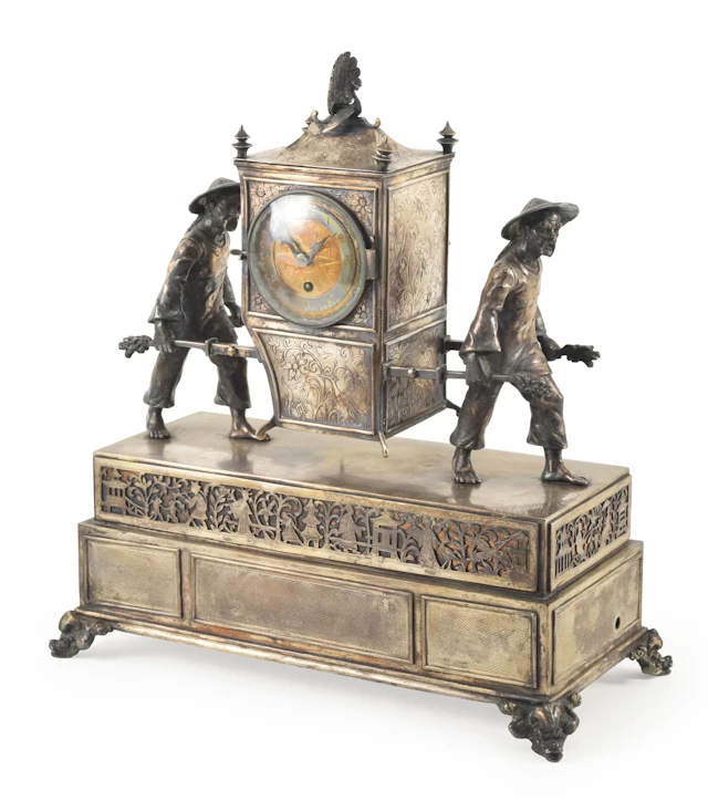 Plated silver figural shelf clock with music box in the form of two