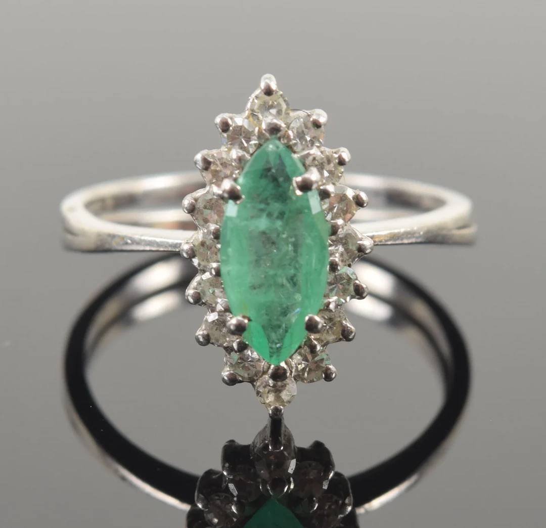 Vintage 14K white gold emerald and diamond ring. Marquis cut emerald