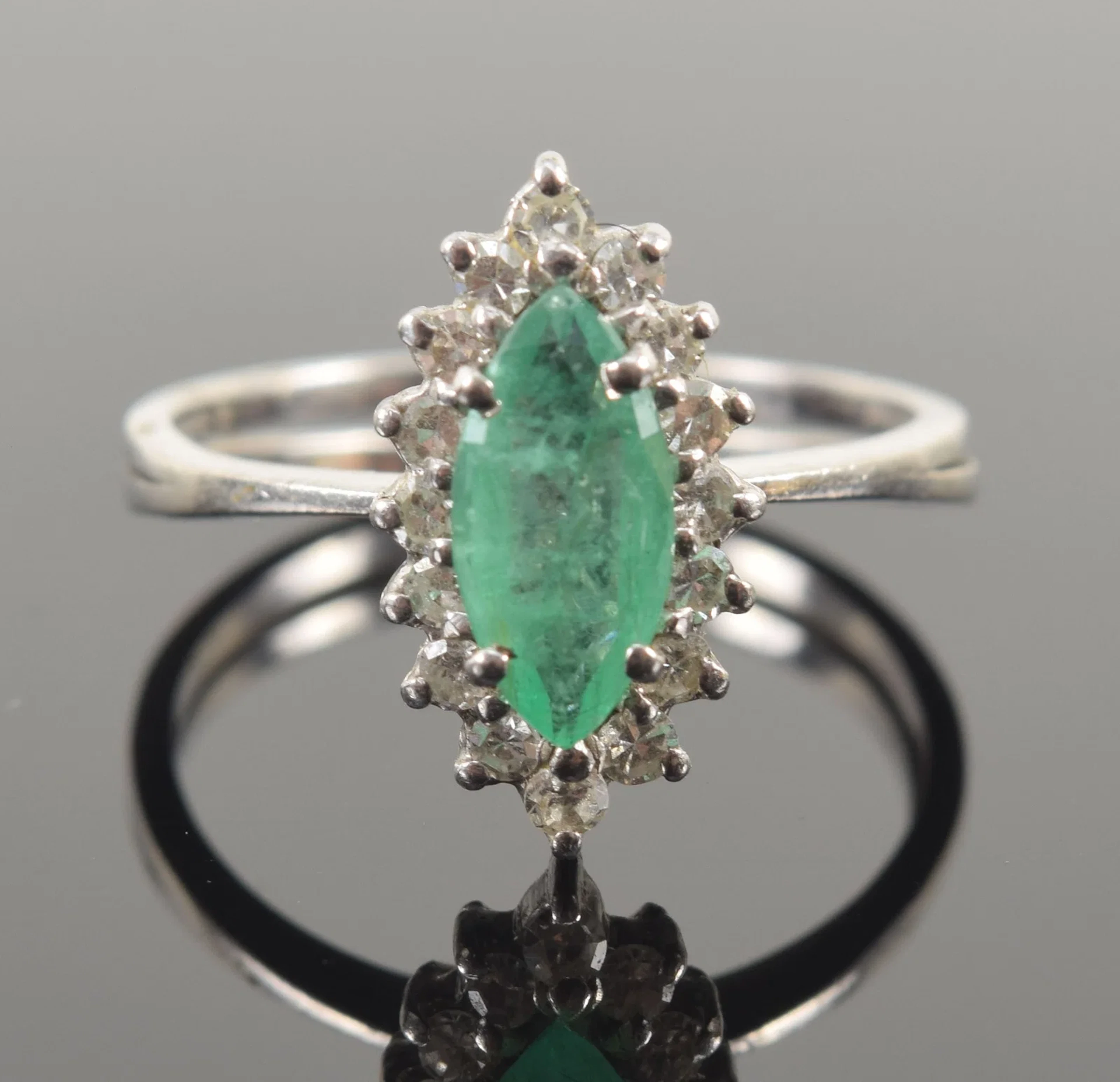 Vintage 14K white gold emerald and diamond ring. Marquis cut emerald