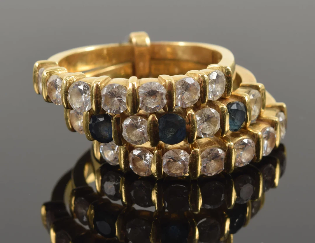 18K gold diamond and sapphire rings. 3 bands joined together; 2 with