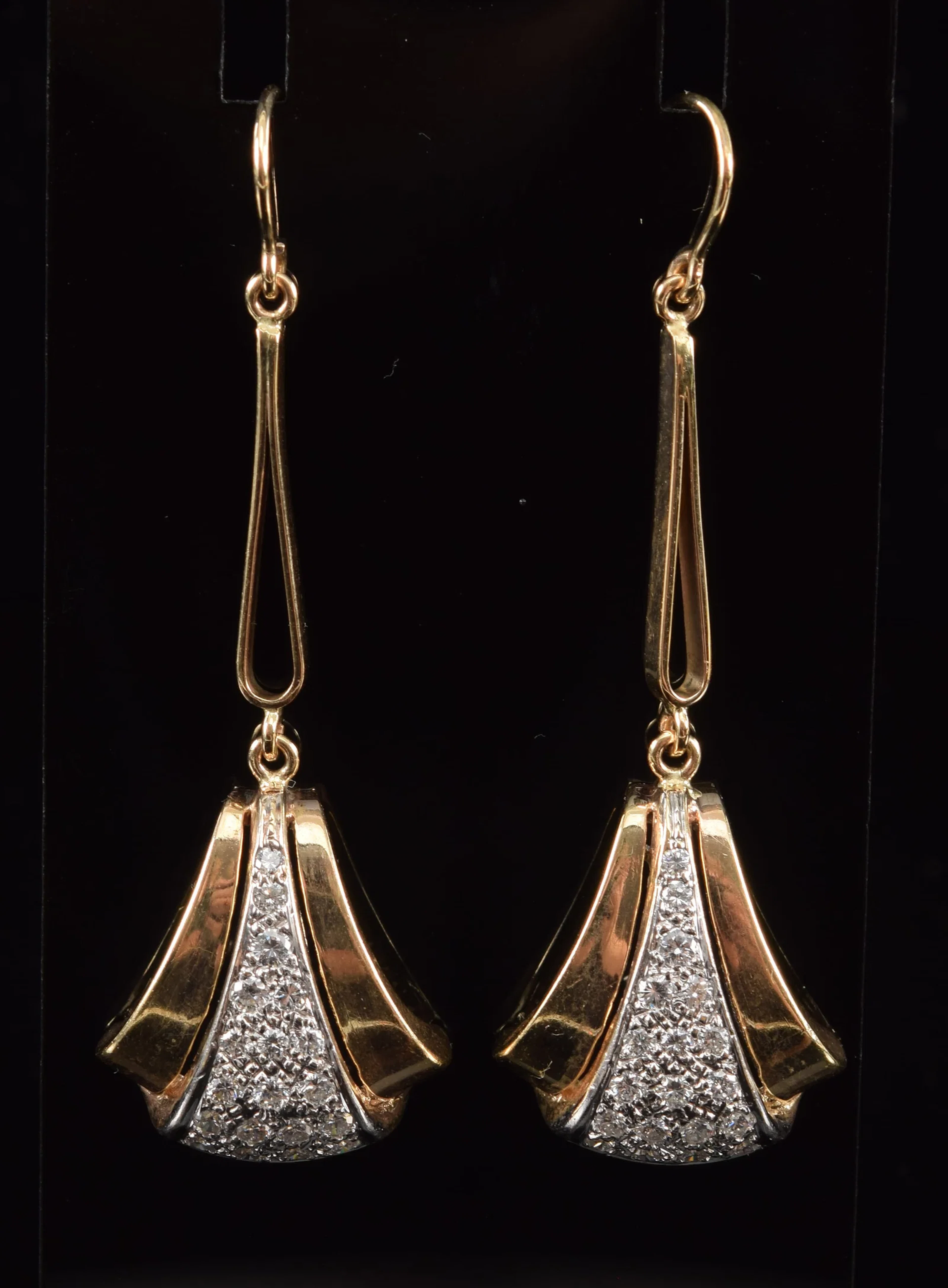 14K gold diamond drop earrings. Tiered triangular form drops with