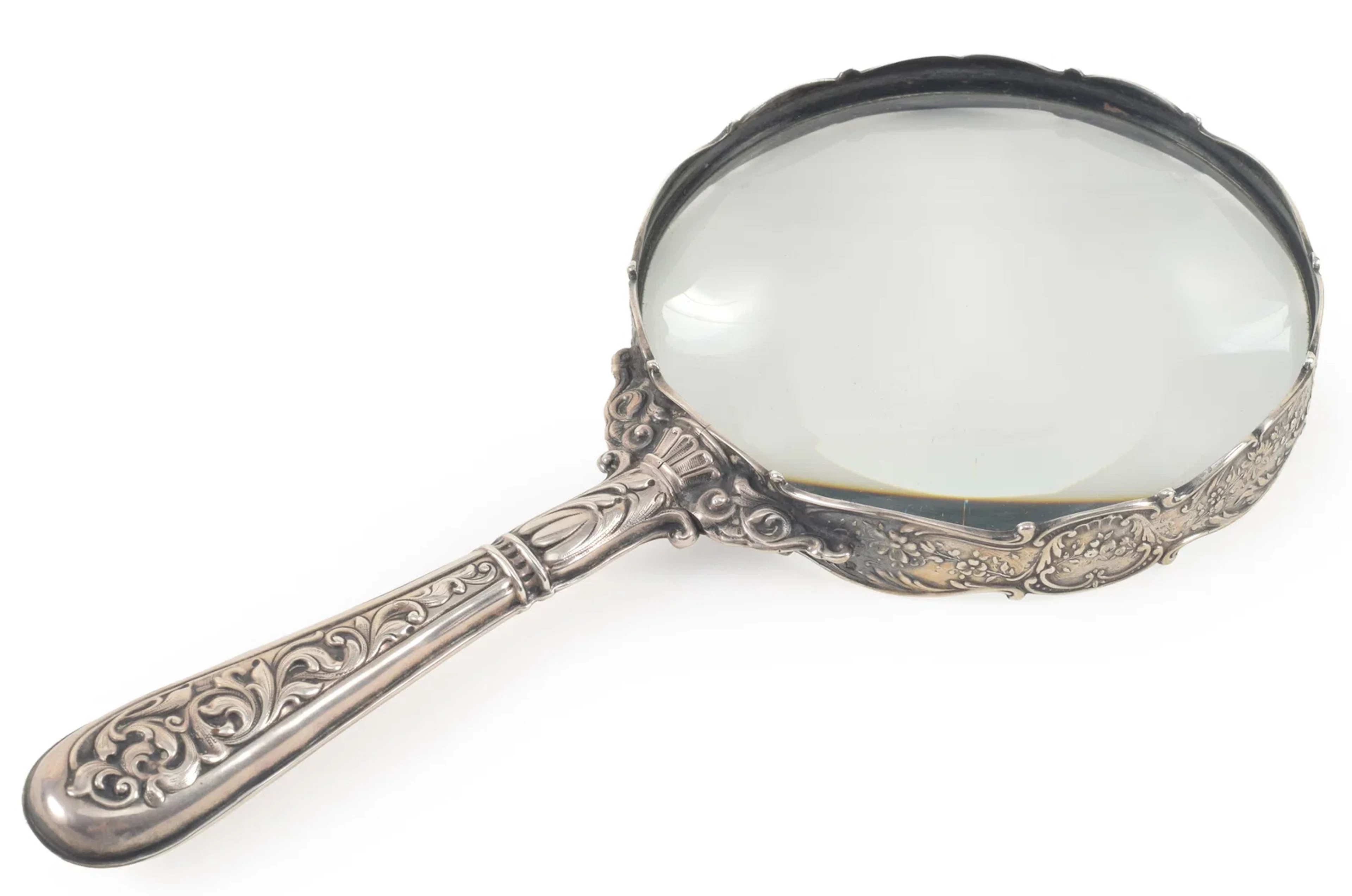 Large Gorham Sterling silver magnifying glass with floral decoration.