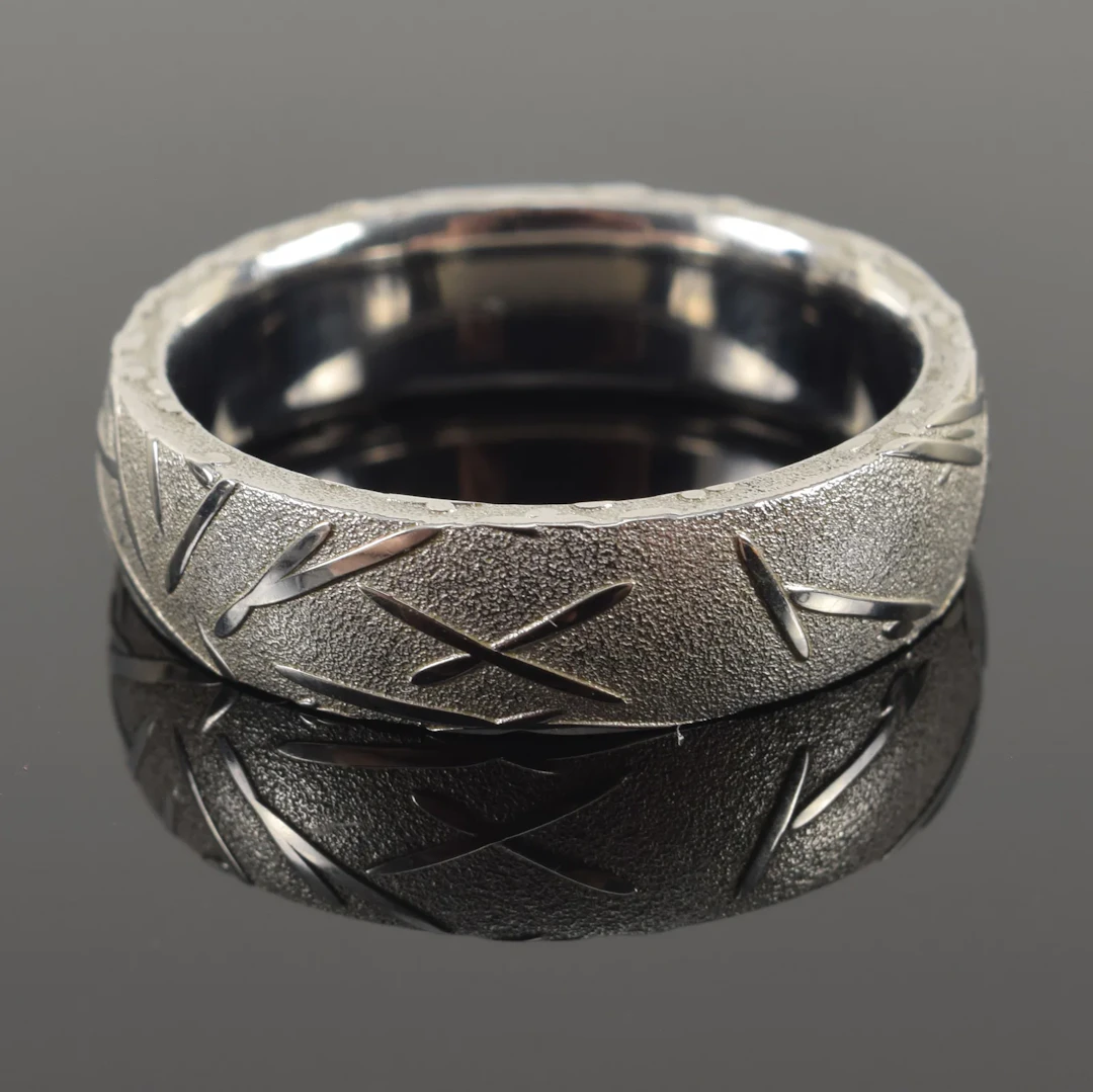 Chris Ploof Damascus steel band. Aesthetic design of scattered pine