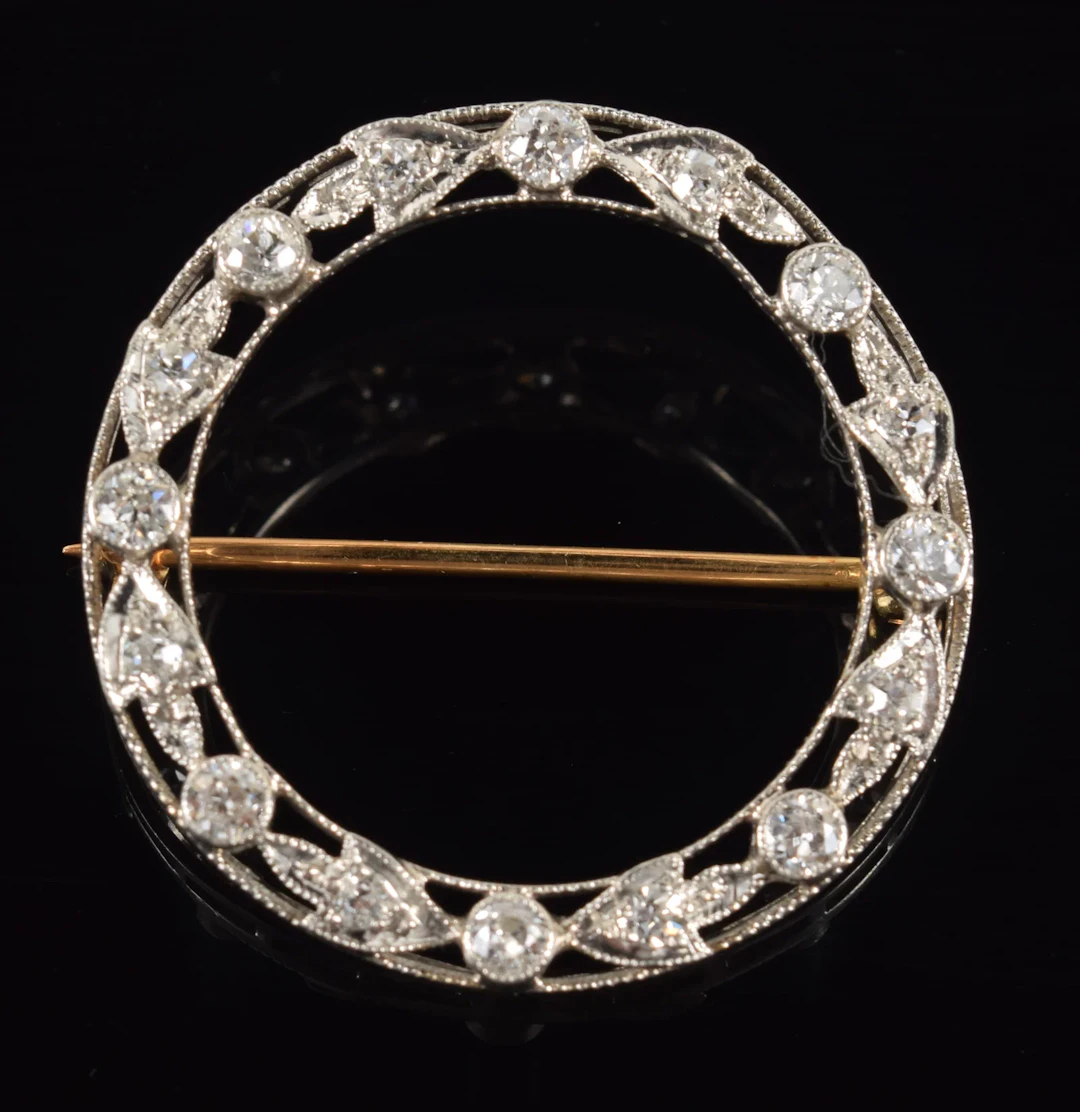 Vintage 14K gold diamond wreath pin. Openwork white gold wreath design