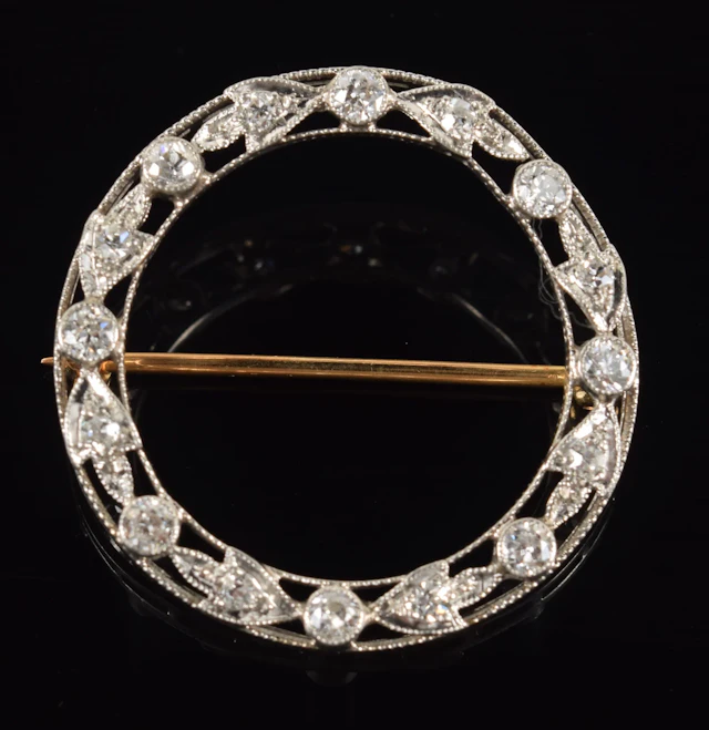 Vintage 14K gold diamond wreath pin. Openwork white gold wreath design