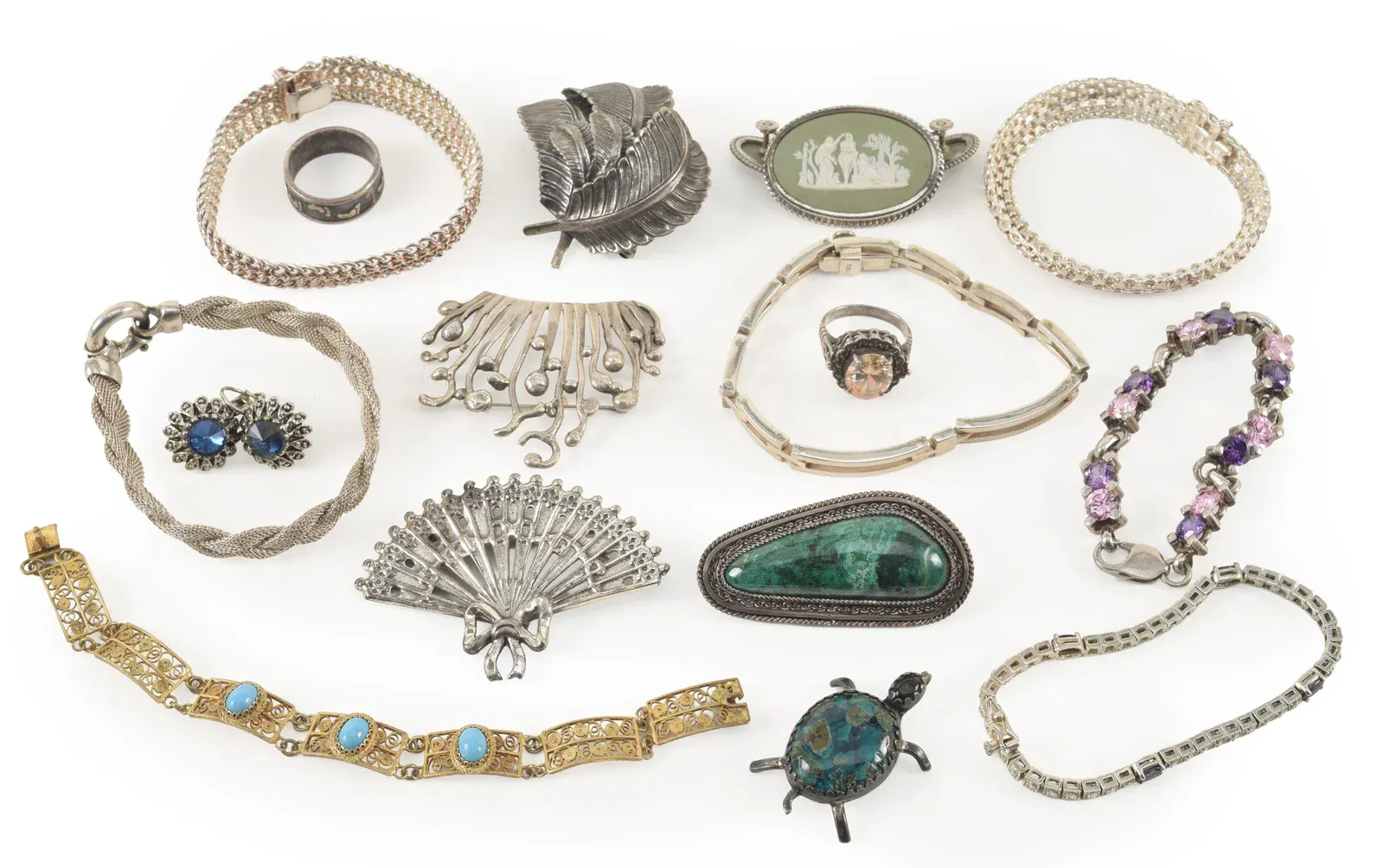 Assortment of silver jewelry. To include: Wedgwood pin and earrings