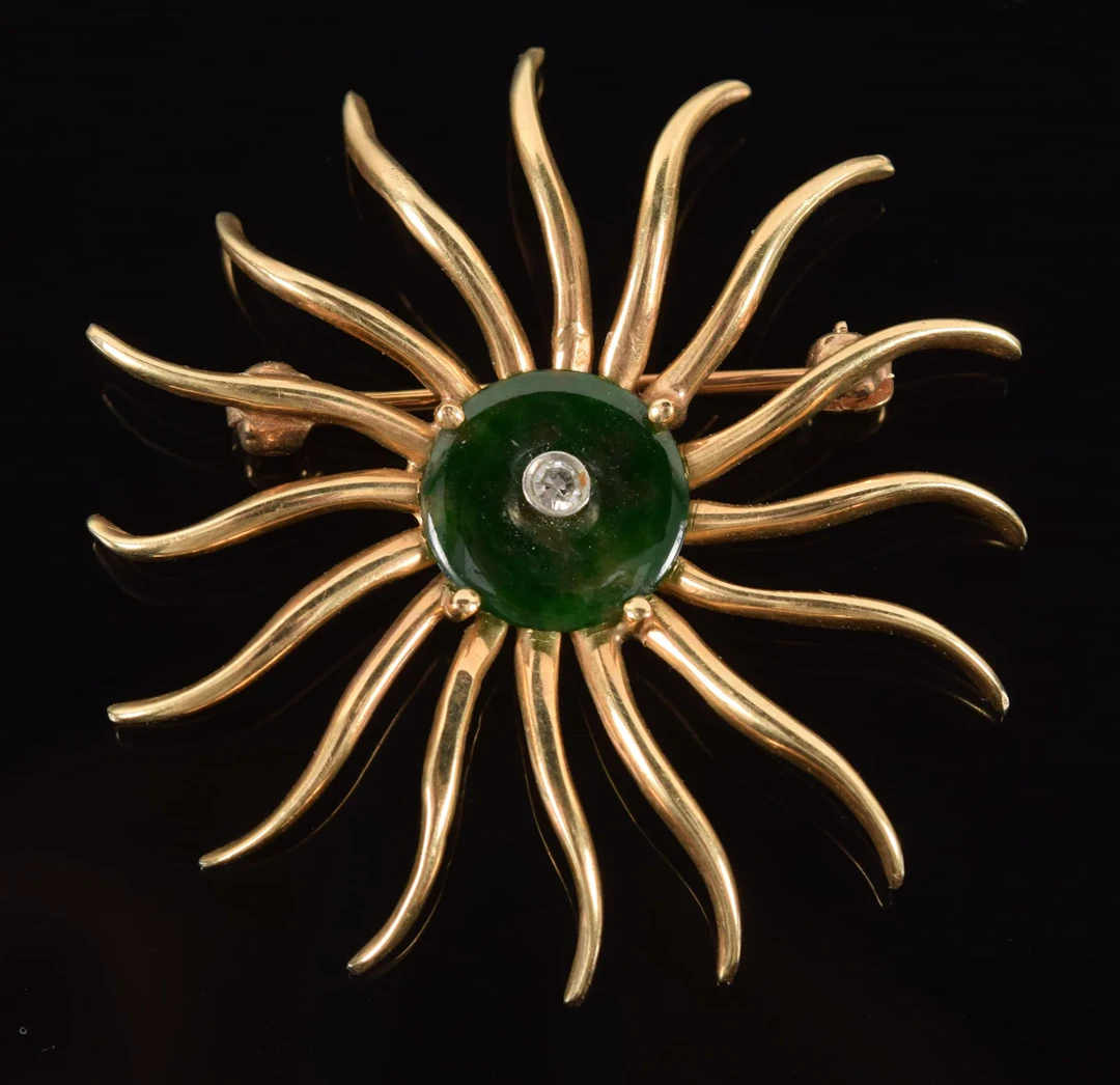 Retro 14K gold sunburst pin set with small round diamond in green