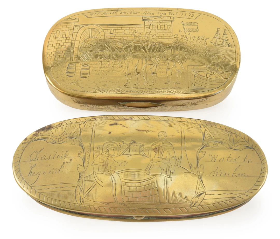 2 Continental engraved oval brass tobacco boxes. One depicting the