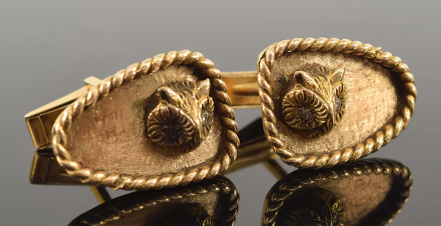 Vintage 14K gold owl head cufflinks. Braid bordered panels with the