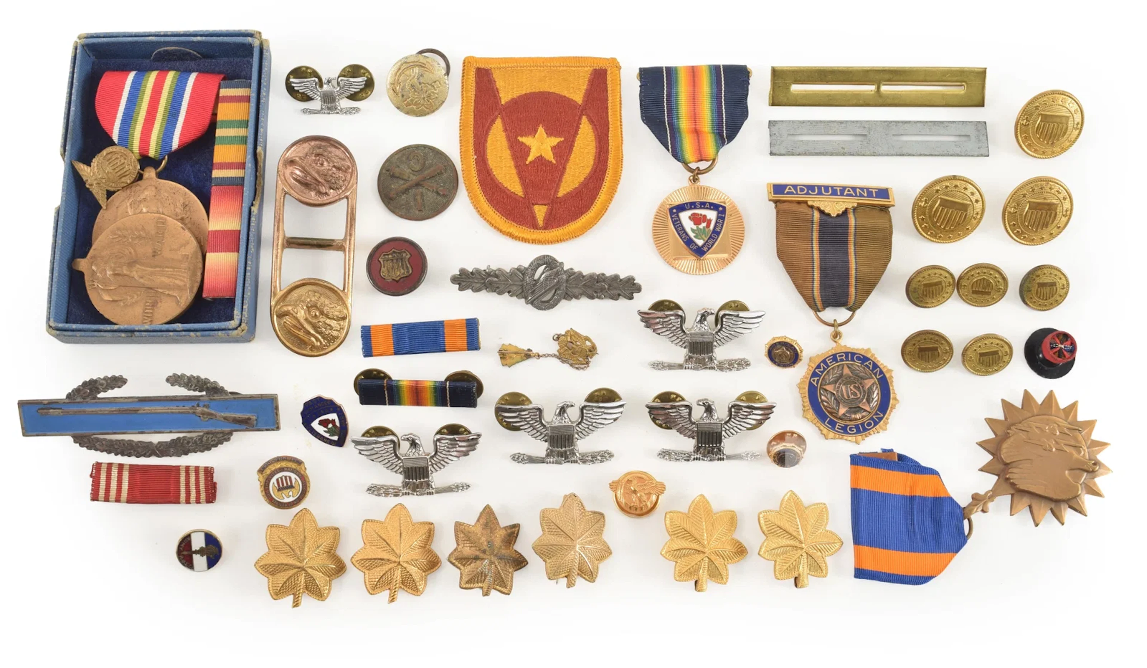 Collection of assorted military badges and insignia.