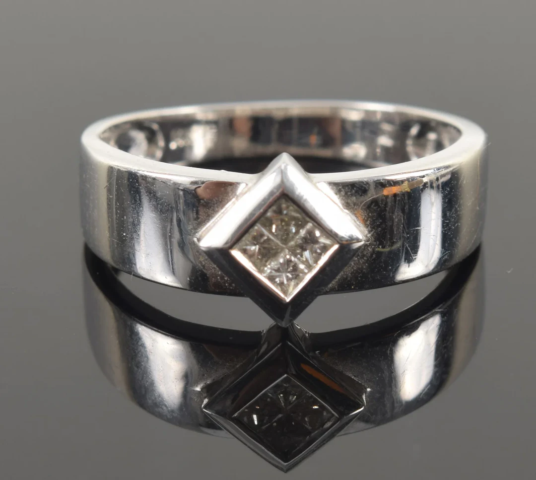 14K white gold diamond ring. 4 small square cut diamonds set together