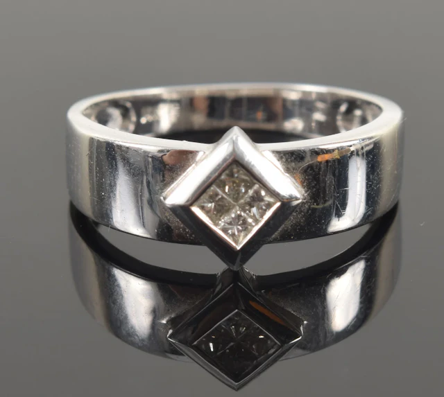 14K white gold diamond ring. 4 small square cut diamonds set together