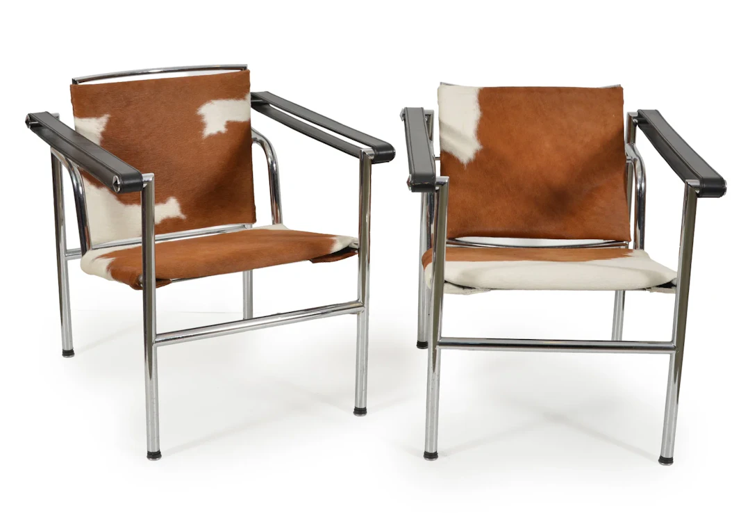Pair of Le Corbusier "Basculant" pony hide sling chairs. Height 25