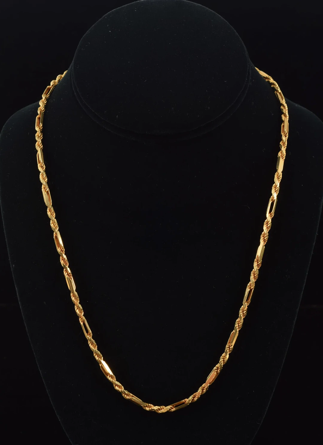 14K gold chain necklace. Heavy rope twist design with elongated spacers.