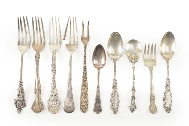 Collection of 10 Silver spoons and forks, some souvenir. Longest 5.75
