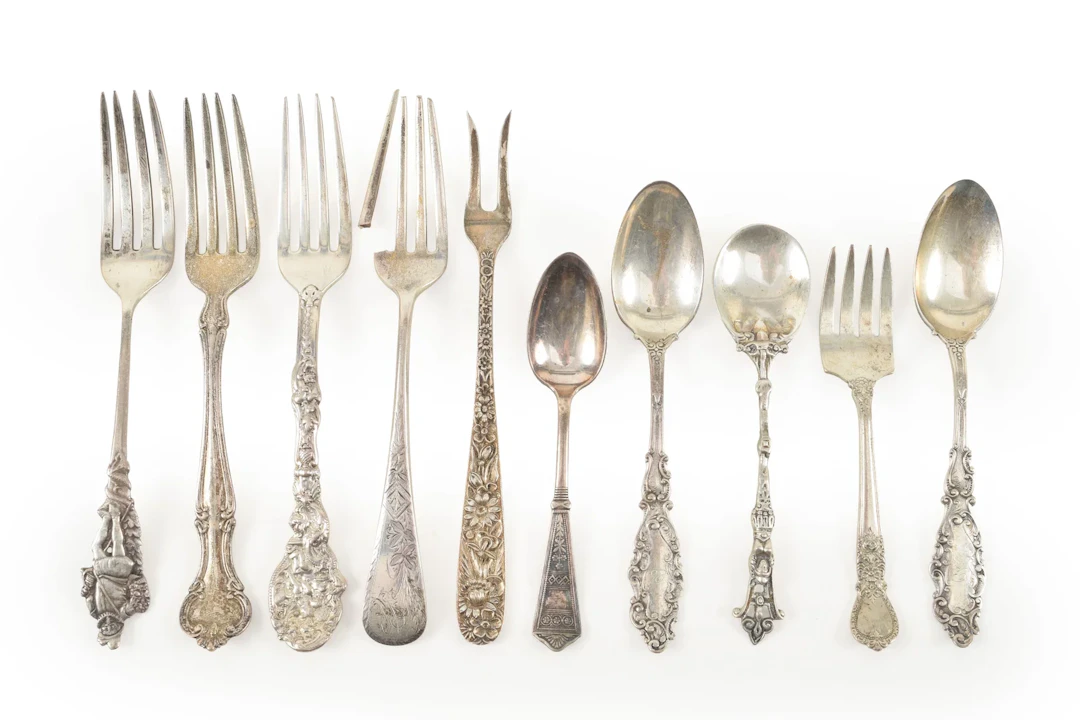 Collection of 10 Silver spoons and forks, some souvenir. Longest 5.75