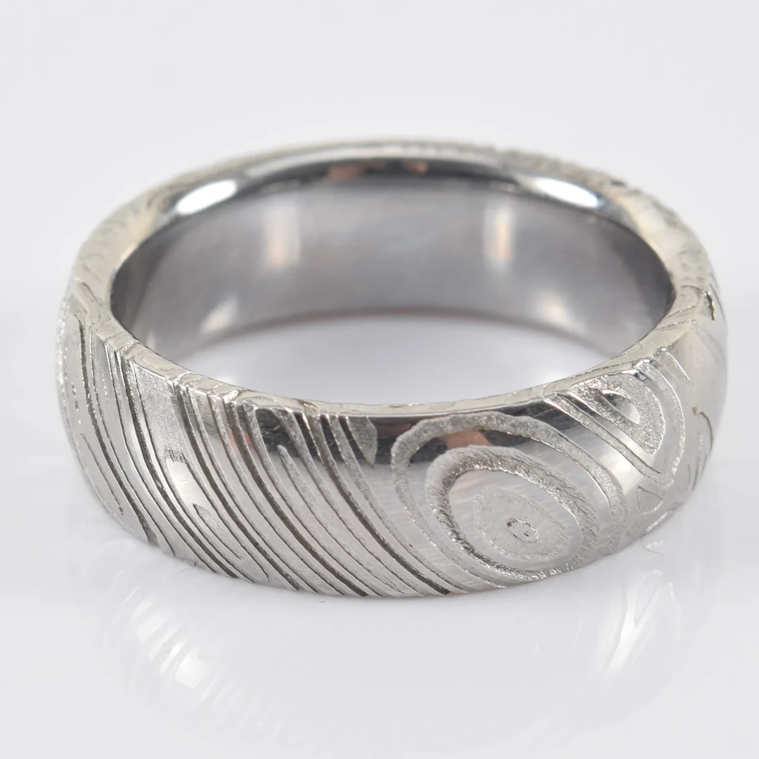 Chris Ploof Damascus steel band. Matte and polished surface design.