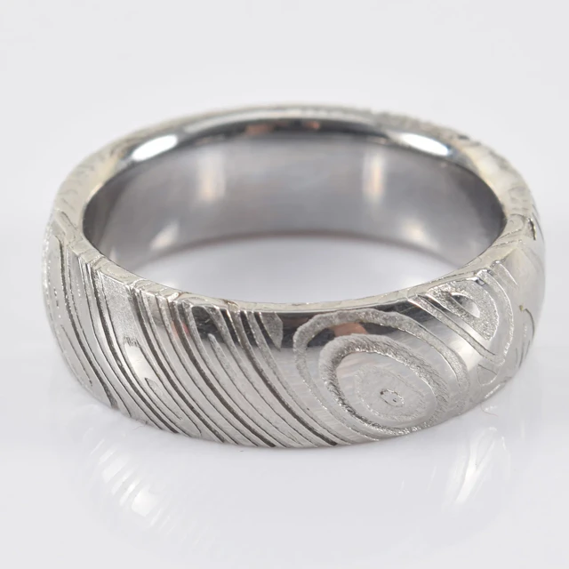 Chris Ploof Damascus steel band. Matte and polished surface design.