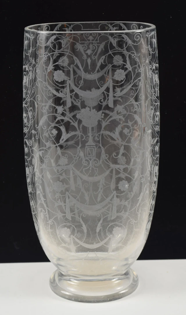 Baccarat etched glass footed vase. Classical scrollwork and garland