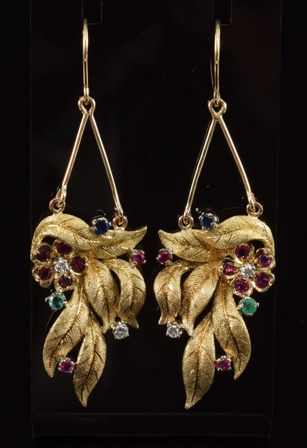 18K gold gem set leaf and floral form earrings. Each set with diamonds