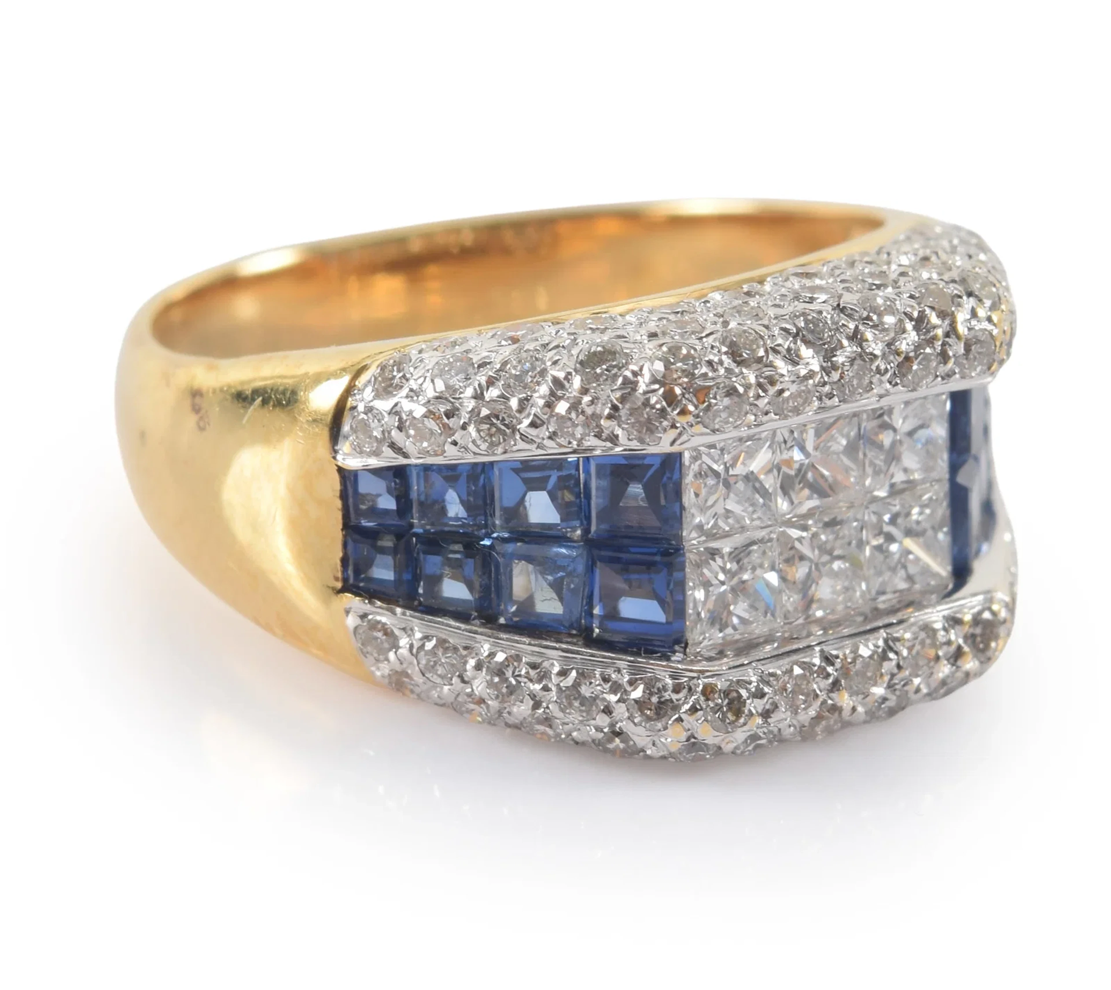 18K gold diamond and sapphire ring. 2 central channels of square cut
