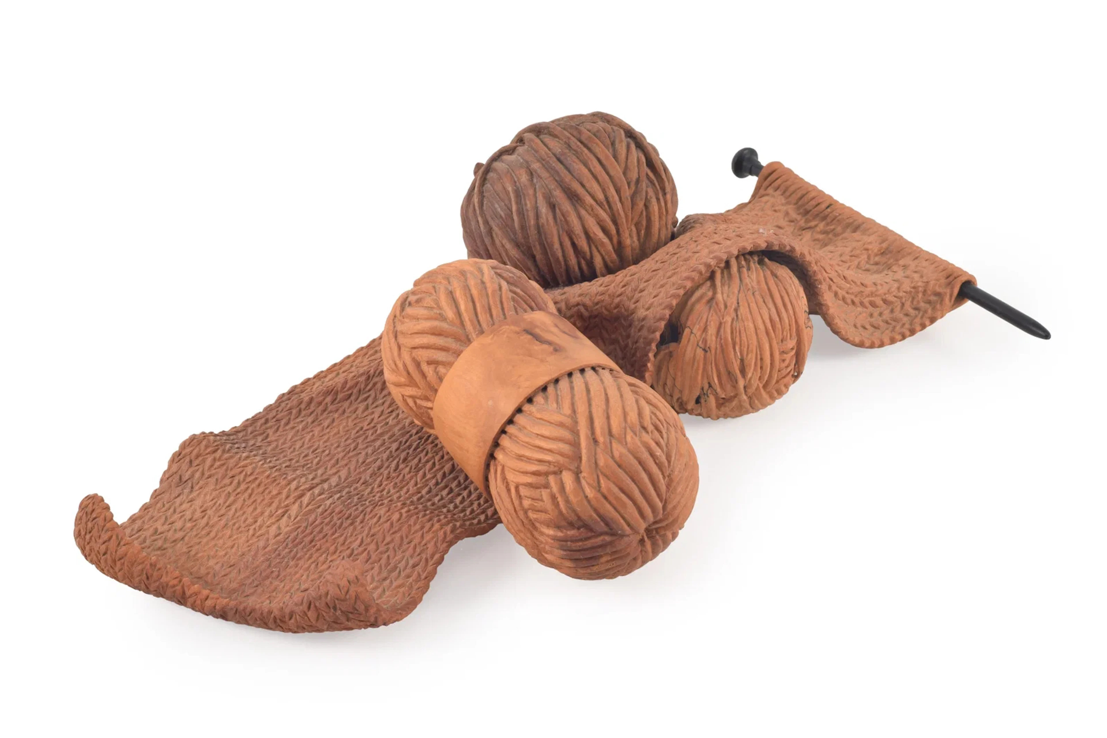 Michelle Holzapfel. "Knitting". Trompe l'oeil wood carving of a knitting
