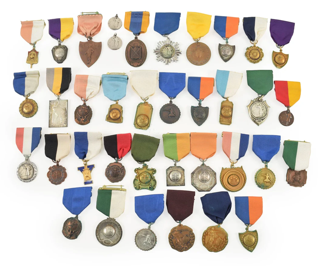 Collection of 37 vintage fencing medals, including some silver. Backsides