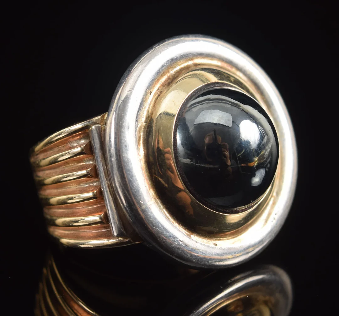 14K gold and silver hematite mounted ring. Bullseye design with hematite
