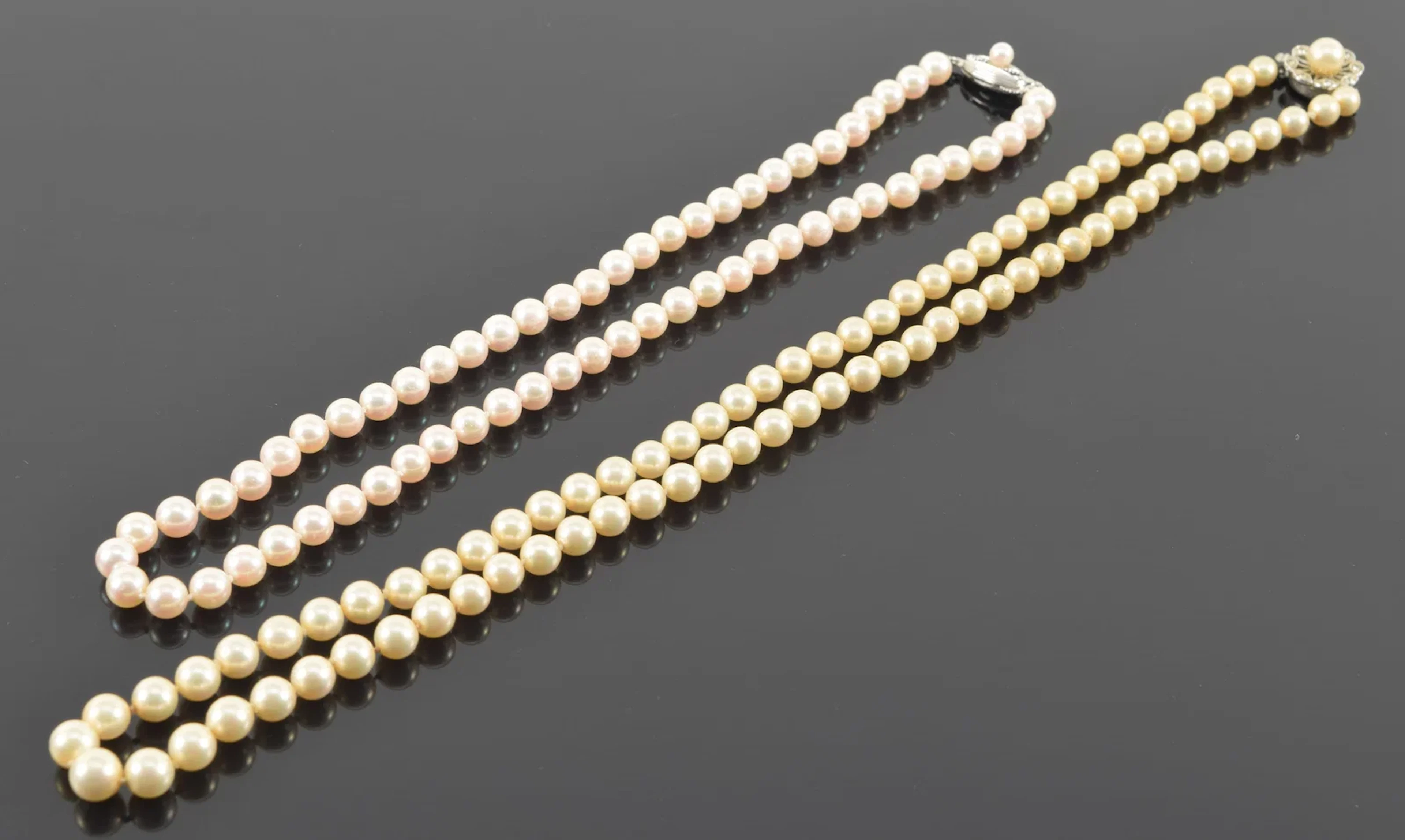 2 silver clasped pearl necklaces. Pearl diameters for each necklace