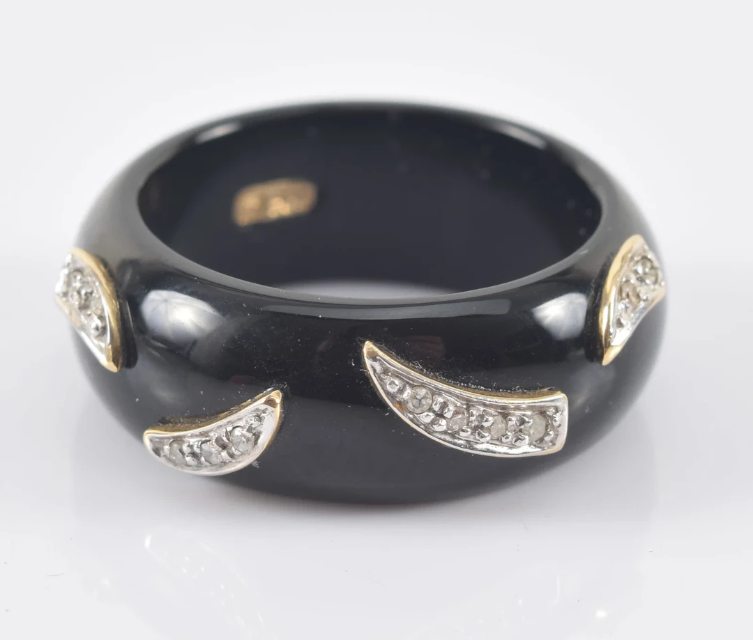 14K gold mounted onyx and diamond ring. Onyx band with yellow gold